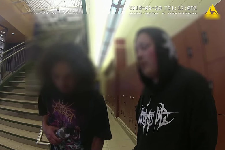 Bodycam footage of the two teenagers, with their faces blurred.
